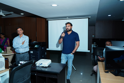 Manager presenting ideas to team during office meeting session