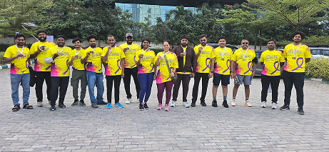 Employees wearing yellow t-shirts during company group event