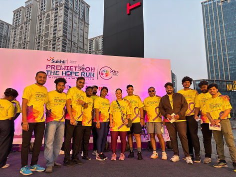 Employees receiving recognition on stage at company event